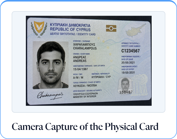 Camera capture of the physical card: a photograph taken of a screen showing the Cyprus ID, read as screen glare and tampering.