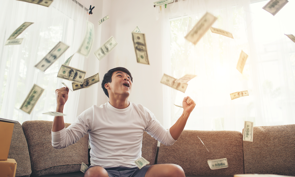 happy-man-with-cash-dollars-flying-home-office-rich-from-business-online-concept