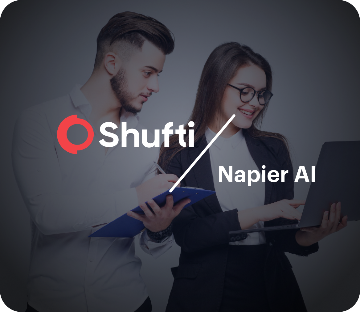 Shufti and Napier AI logo lockup over two analysts reviewing a laptop